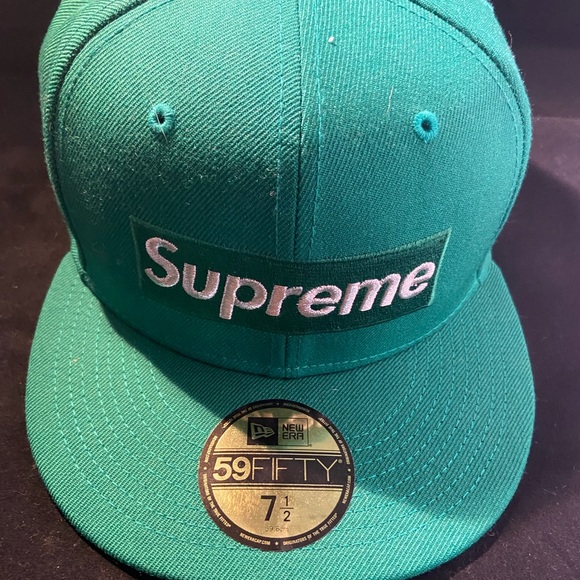 Green fitted hat.